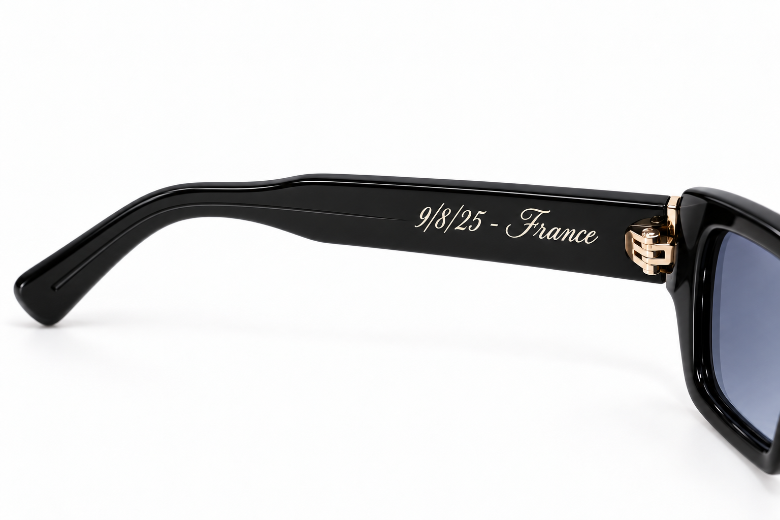 SoHo Black sunglasses with 9/8/25 - France engraved in classic script on the inside arm